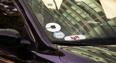 carwith a lyft sticker on it